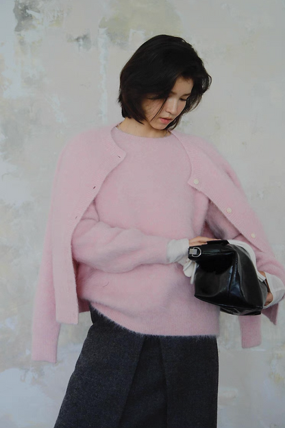 Pink cardigan layered over matching sweater – cozy chic winter look