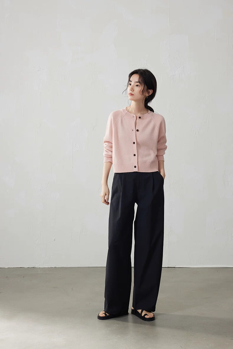 Soft Pink cropped wool cardigan with relaxed standing pose