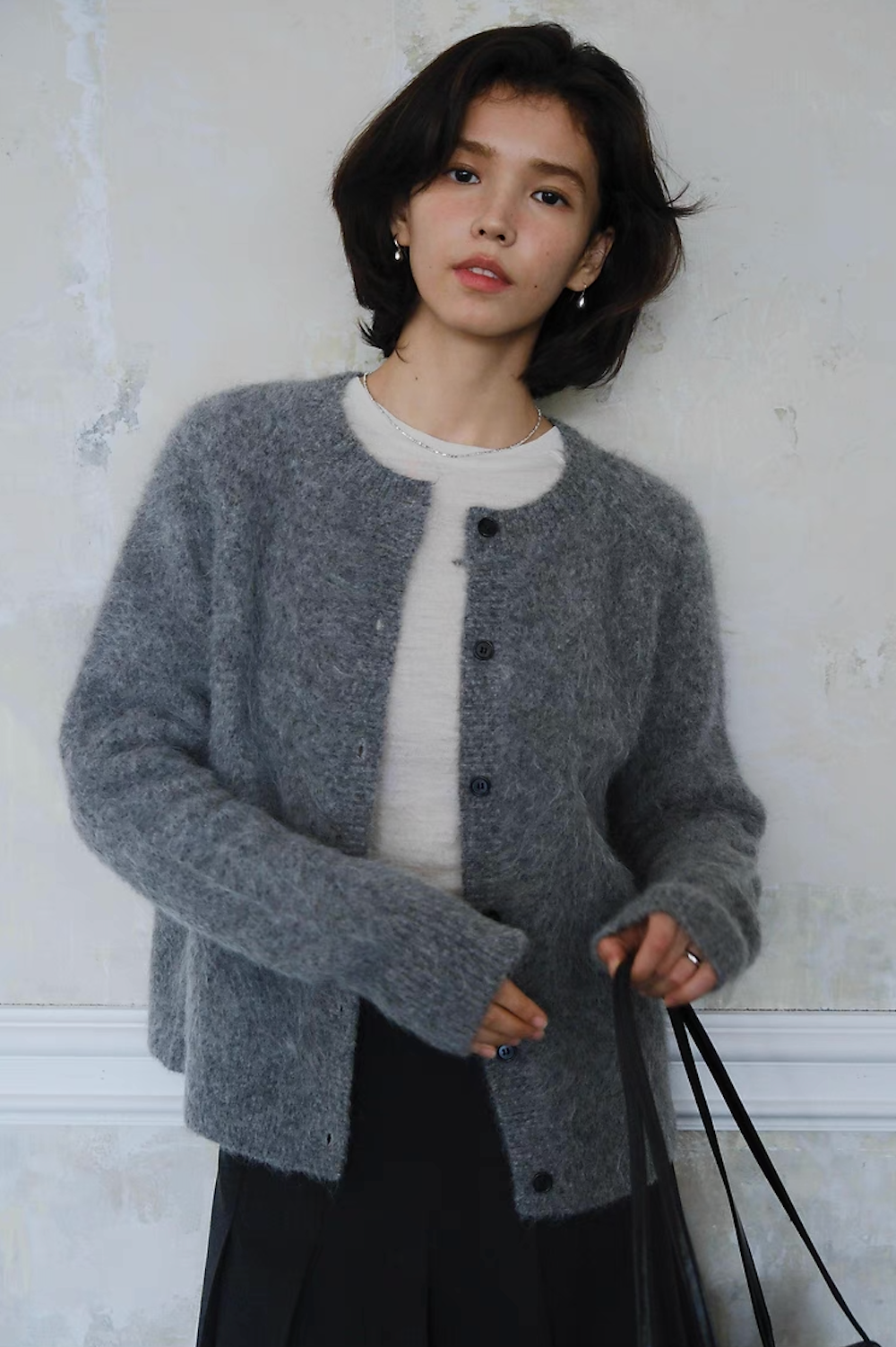 Woman wearing grey fuzzy button-up cardigan, casual chic fall outfit