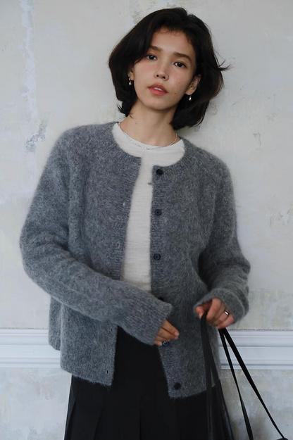 Woman wearing grey fuzzy button-up cardigan, casual chic fall outfit