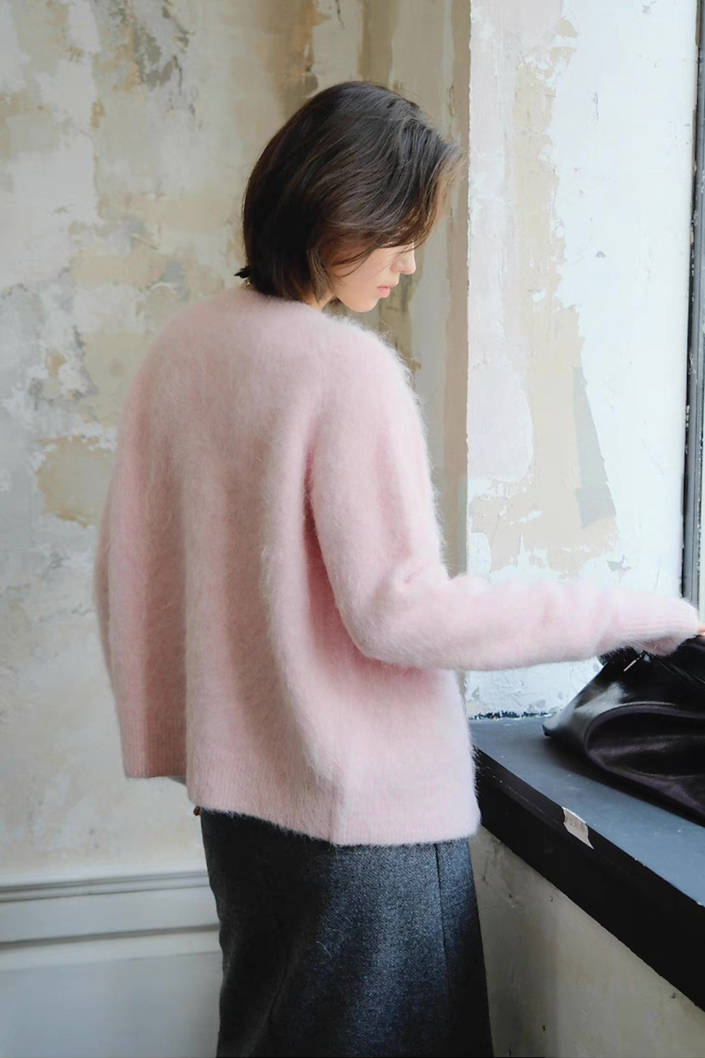 Back view of soft pink fluffy cardigan for women, cozy winter knitwear