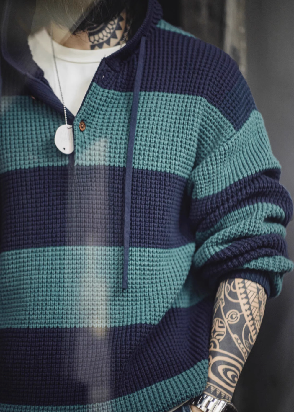 Close-up of Casual Striped Waffle-Knit Pullover Hoodie Blue-Green Stripes emphasizing waffle knit texture wooden button placket and soft breathable fabric