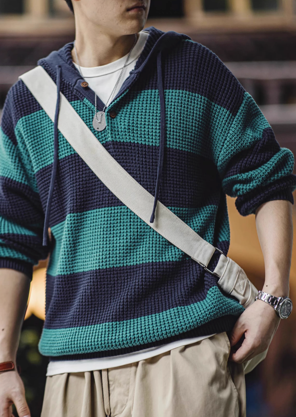Casual Striped Waffle-Knit Pullover Hoodie in Blue-Green Stripes worn by model showing relaxed fit drawstring hood bold stripe design and casual everyday styling