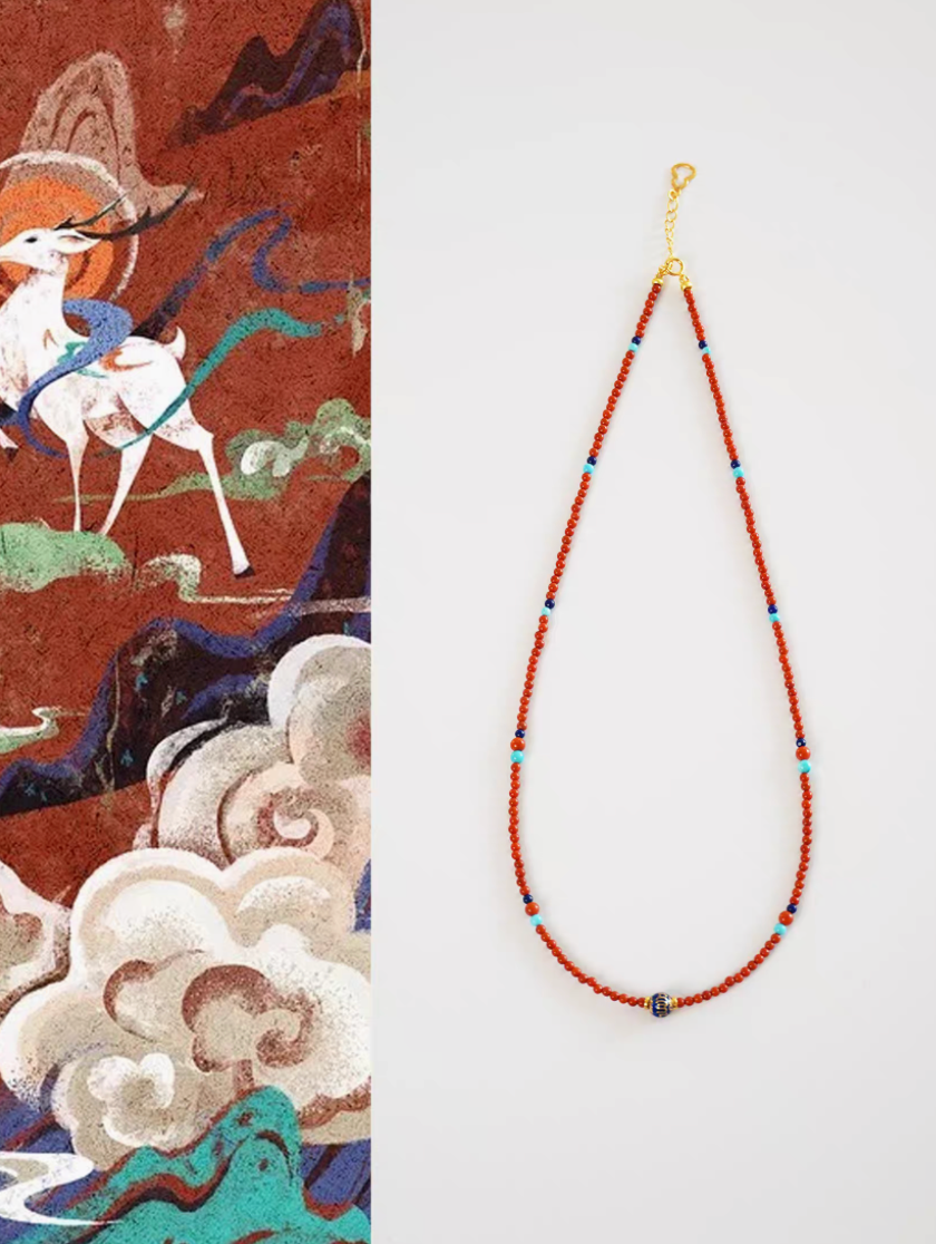 Celestial Harmony beaded necklace with red agate beads, turquoise accents, and lapis lazuli centerpiece on white background