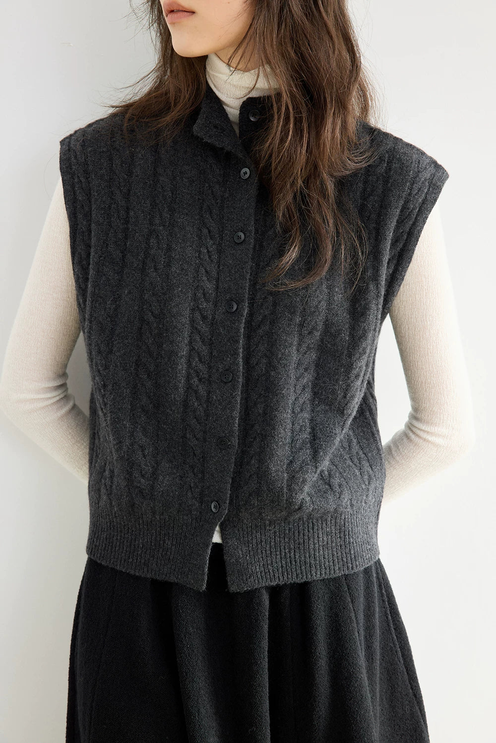 Close-up of Charcoal Gray wool vest showing cable-knit texture, stand collar and button front