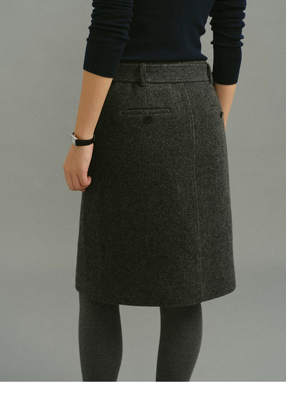 Back view of Charcoal Gray wool skirt showing belt loops and buttoned welt pockets