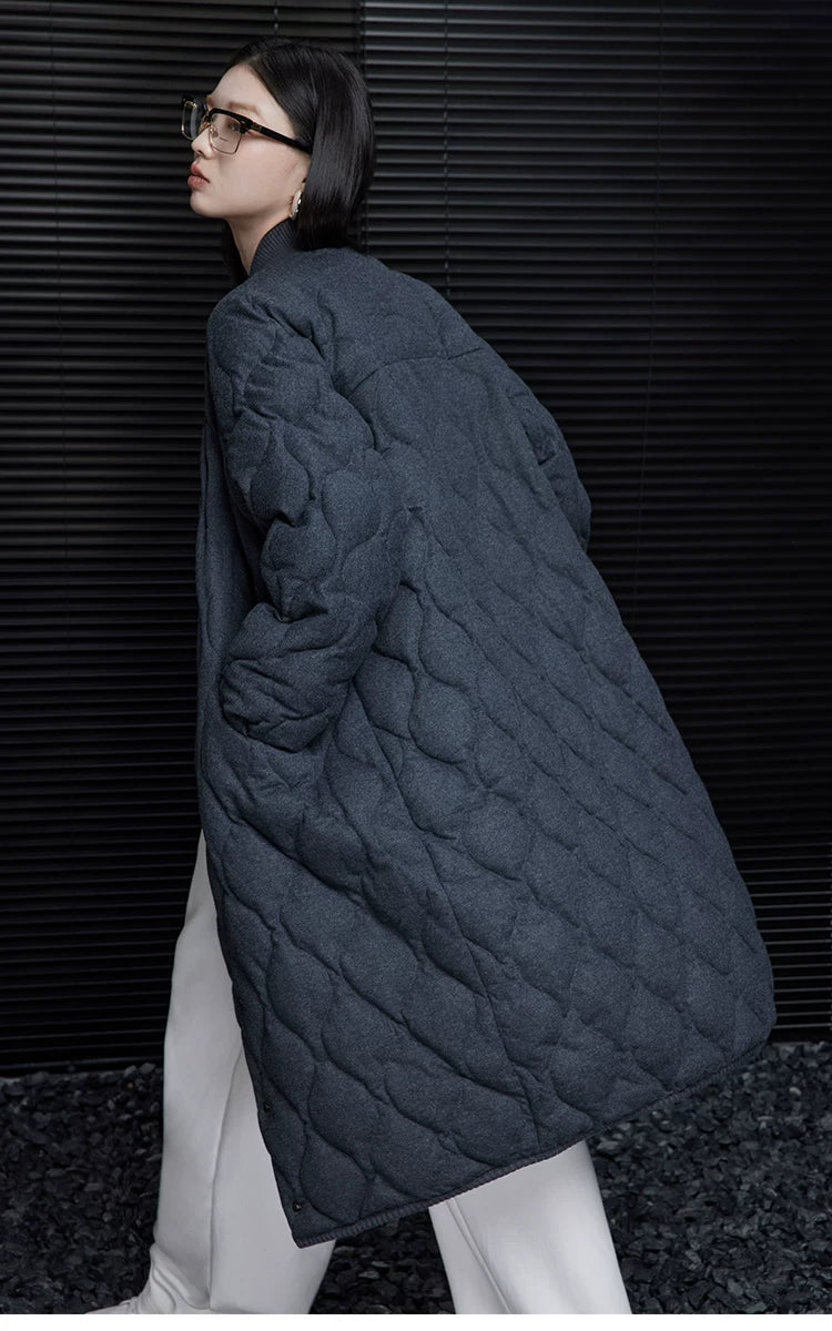 Back-side view of a Charcoal quilted wool down coat showing raglan sleeves and mid-calf length