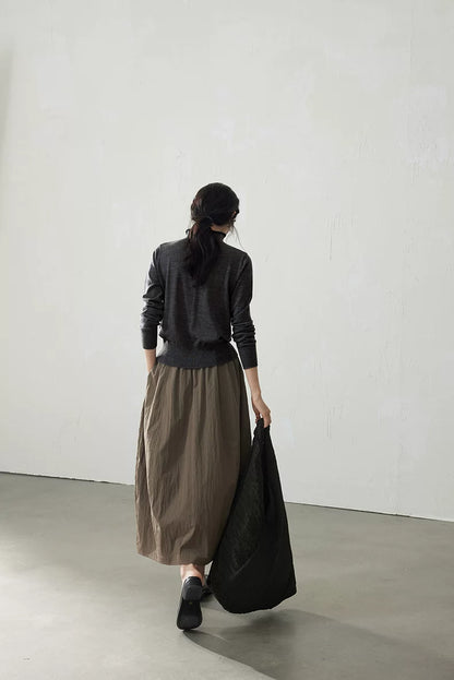 Charcoal wool cardigan, back view walking