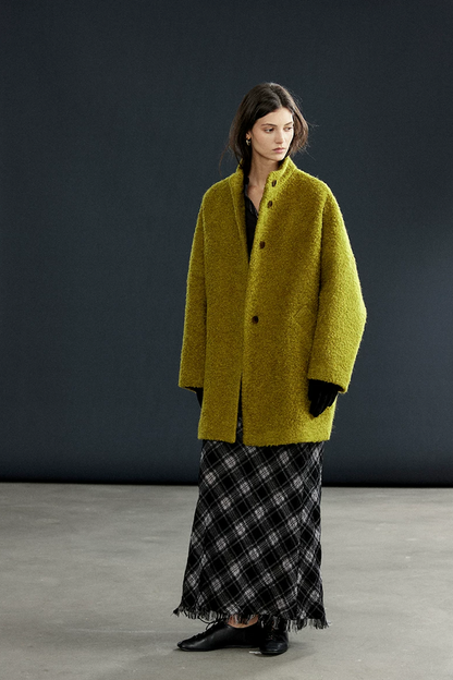 Full-length view of a Chartreuse bouclé wool coat with stand collar and straight H-line cut