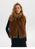 Chestnut cropped faux fur vest with stand collar and open front, worn over a black turtleneck