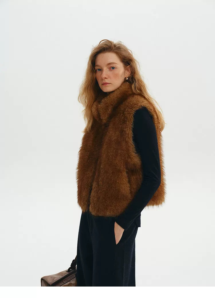 Three-quarter view of a Chestnut cropped faux fur vest with hidden side pocket