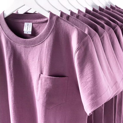 Chic Pocket Tee purple multiple shirts hanging on rack showing relaxed fit and soft cotton fabric