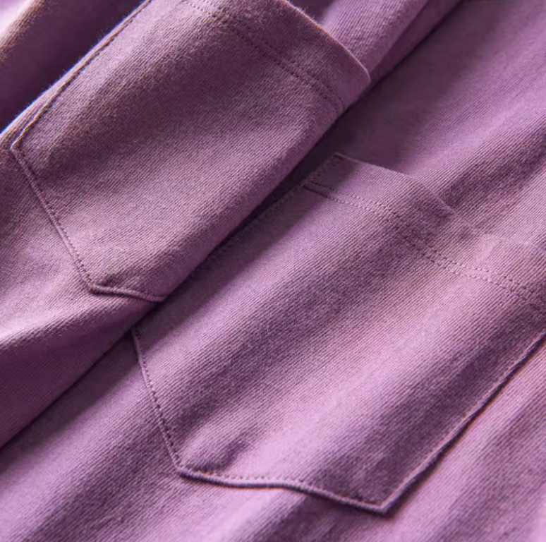 Chic Pocket Tee purple chest pocket close-up showing stitching and fabric texture detail