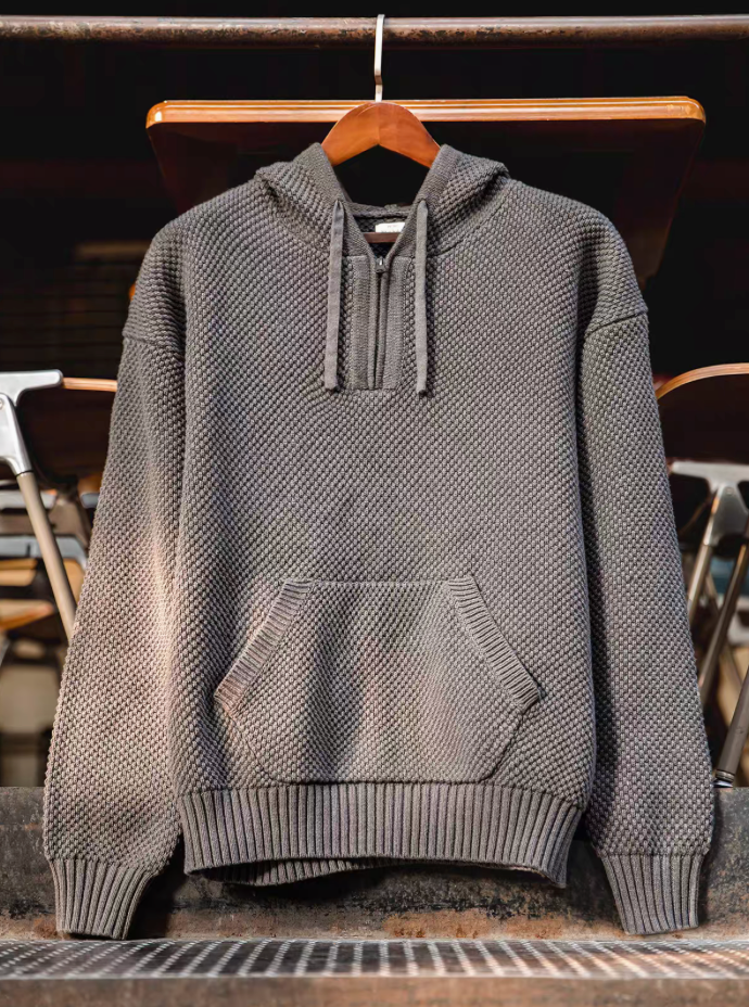Chunky Waffle Knit Pullover Hoodie gray hanging display highlighting structured knit texture and front pocket design