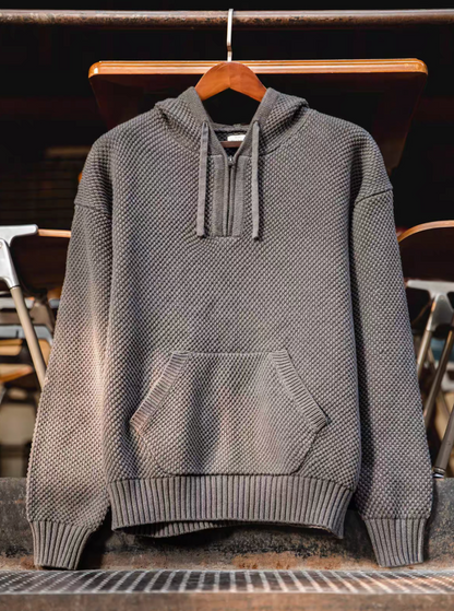 Chunky Waffle Knit Pullover Hoodie gray hanging display highlighting structured knit texture and front pocket design