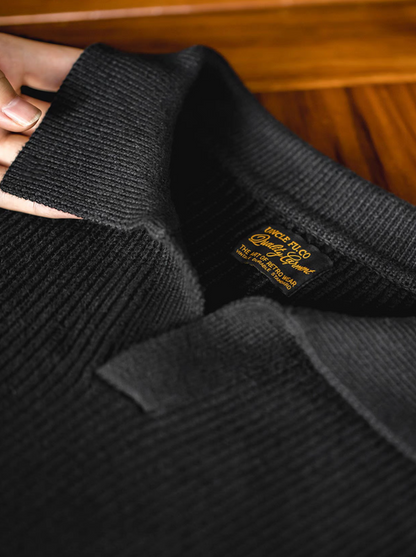 Classic Ribbed Knit Polo Sweater black close-up of collar and ribbed knit fabric texture with brand label detail