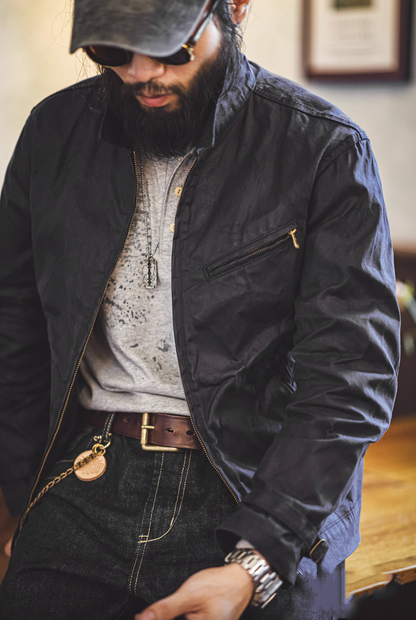 Dark Blue Classic Trail Waxed Jacket worn by model in a three-quarter view showing waxed finish and relaxed fit
