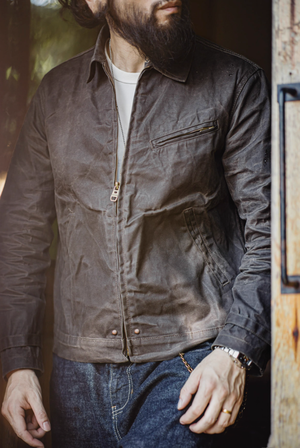 Man wearing Pewter Gray Classic Trail Waxed Jacket front view styled with denim for a rugged casual look