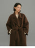 Dark coffee camel-blend coat shown belted from the front with wide lapels.