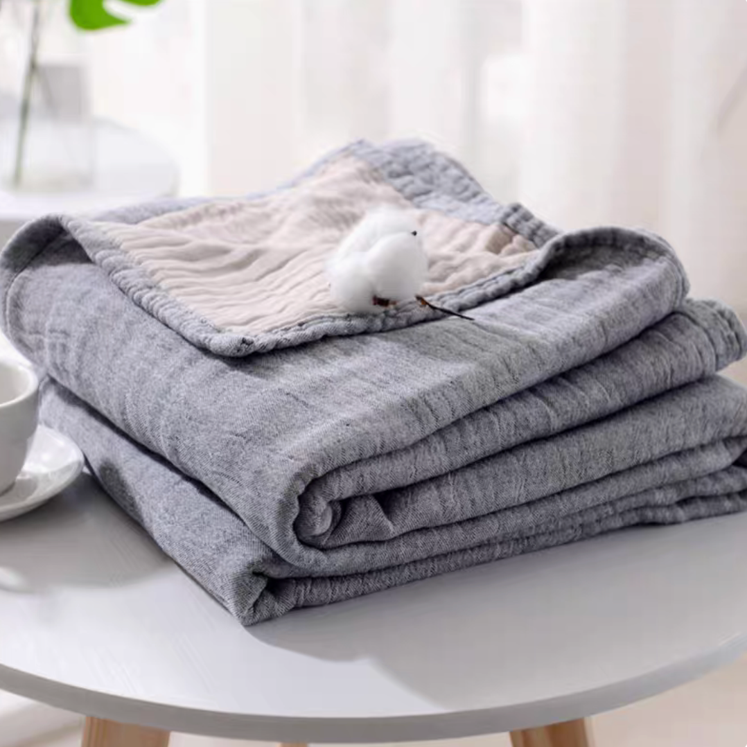 CloudSoft Four-Layer Gauze Cotton Blanket in Gray Camel folded with plush layered cotton gauze and cozy styling