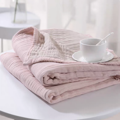 CloudSoft Four-Layer Gauze Cotton Blanket in Pink Camel folded on table showing soft four-layer gauze cotton texture