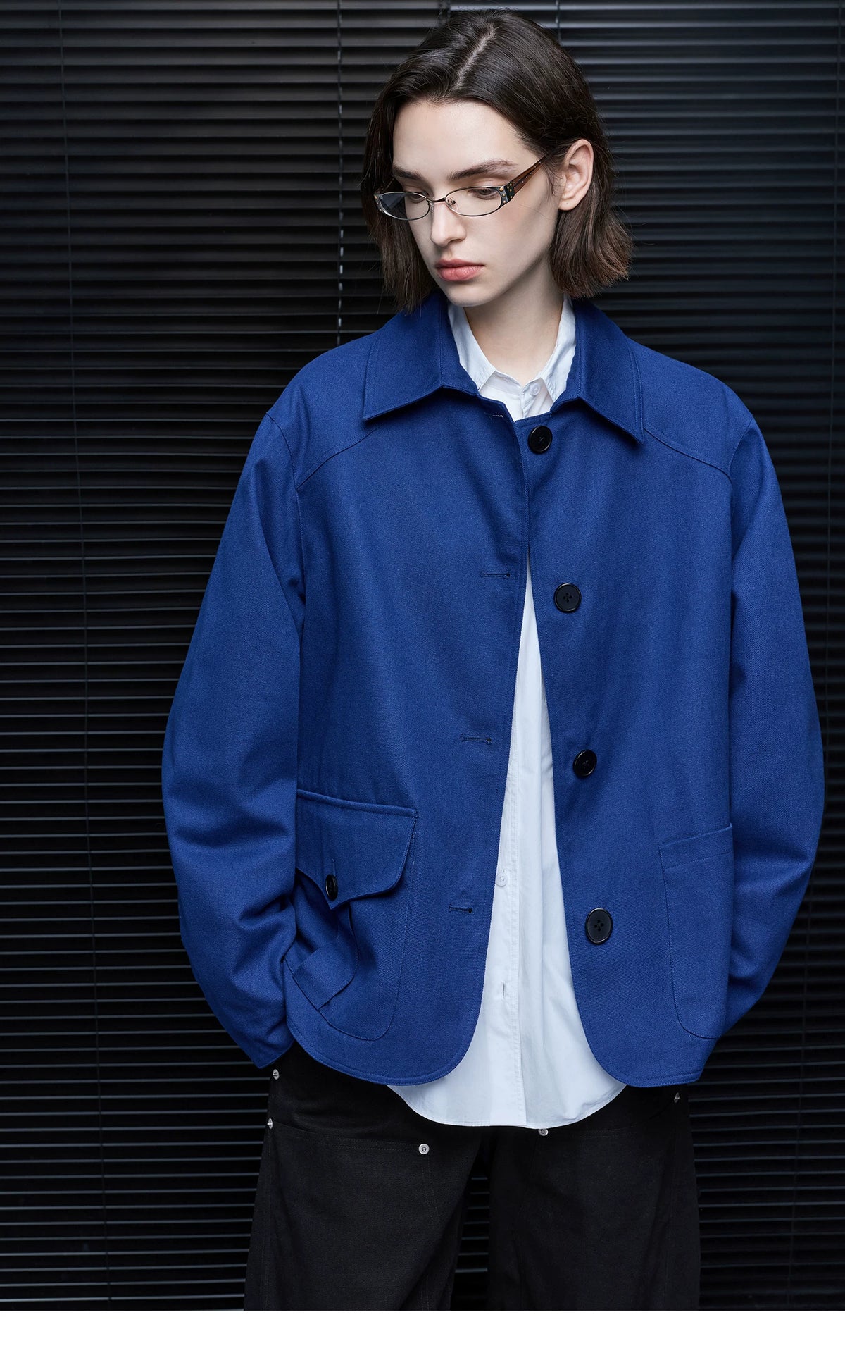Front view of a Cobalt Blue chore jacket showing one buttoned flap pocket and one open patch pocket