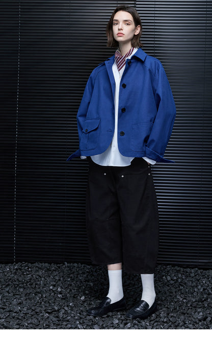 Full-length front view of a Cobalt Blue hip-length cotton chore jacket worn open