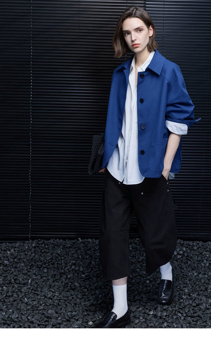 Full-length view of a Cobalt Blue oversized cotton chore jacket with point collar and rolled sleeves