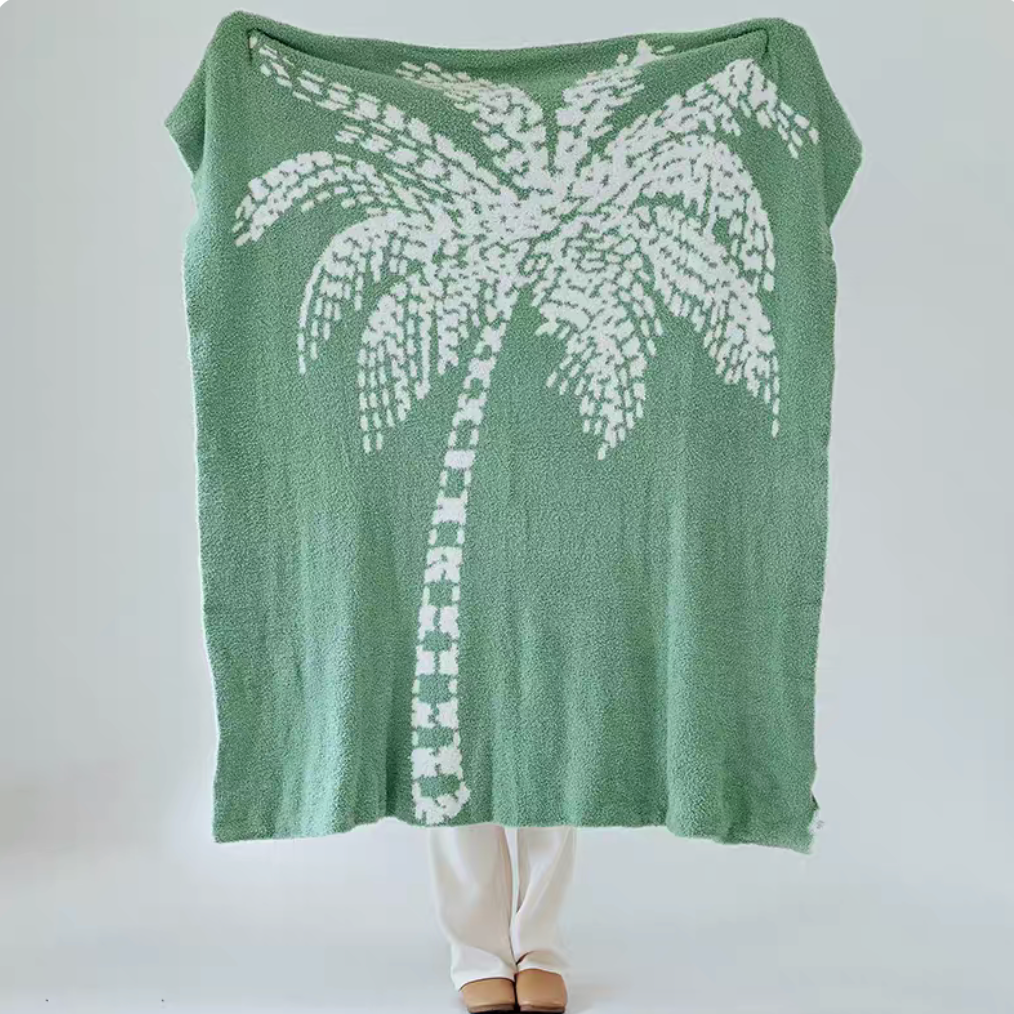 Green coconut tree jacquard throw blanket fully displayed with large white palm tree design