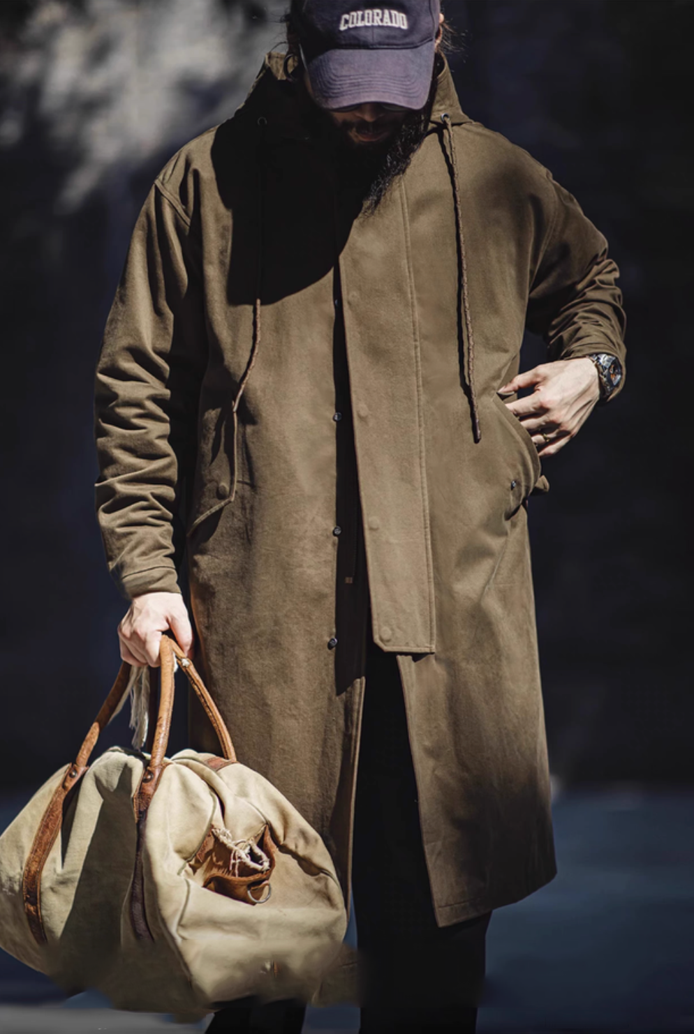 Model wearing Coffee Brown Cotton Windbreaker Coat in army green front view styled casually with relaxed fit and mid-length design