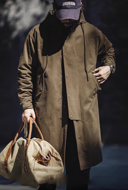 Model wearing Coffee Brown Cotton Windbreaker Coat in army green front view styled casually with relaxed fit and mid-length design