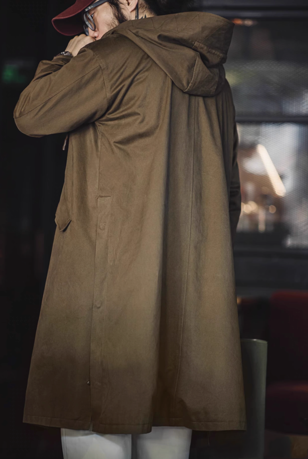 Back view of Coffee Brown Cotton Windbreaker Coat in army green showing hood structure and long straight silhouette