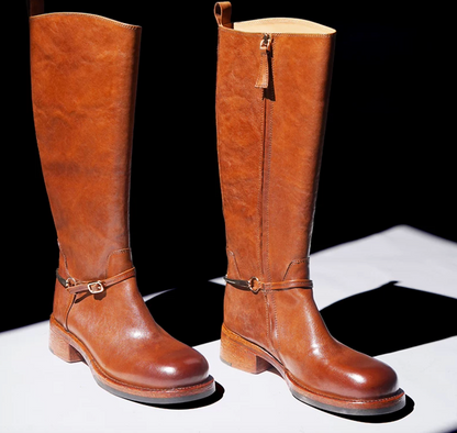 Cognac horse leather riding boots with an inner side zipper and buckled spur strap