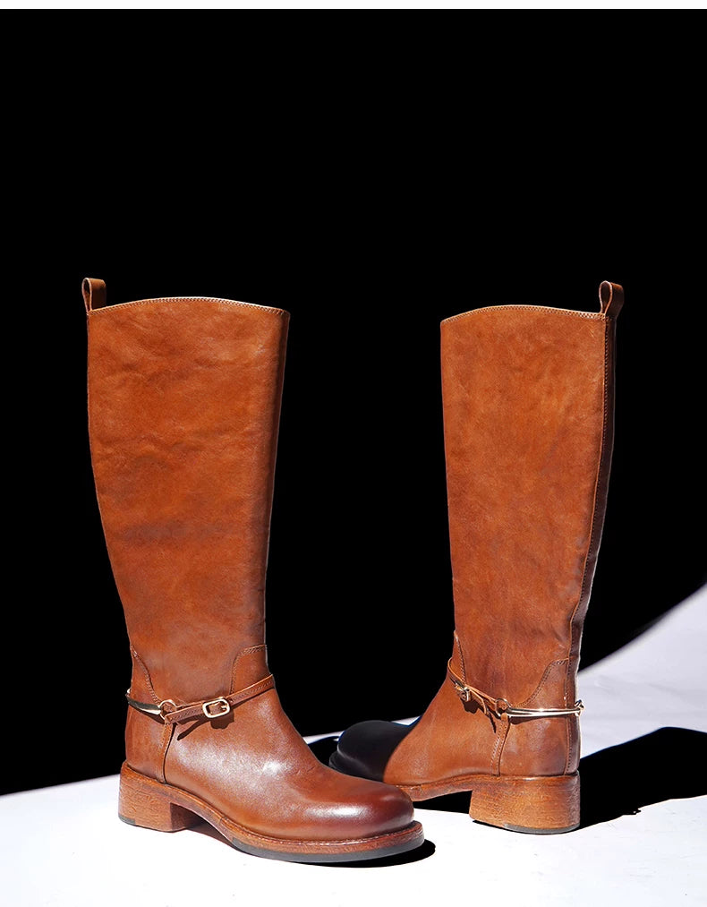 Pair of cognac knee-high horse leather boots with a round toe and block heel