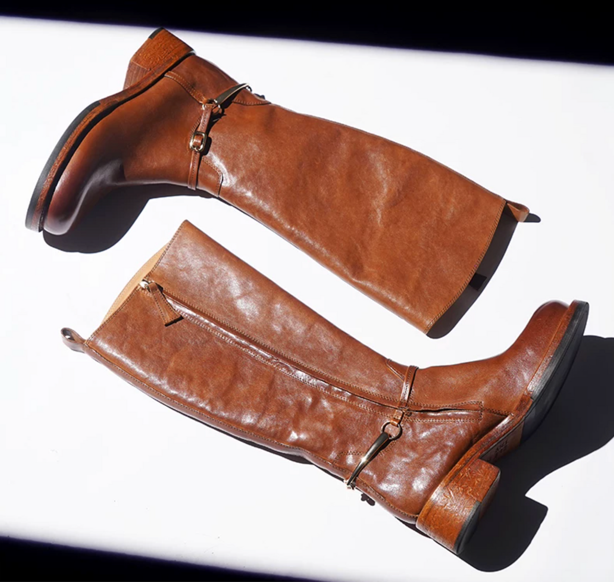 Top view of cognac washed horse leather riding boots with natural creasing