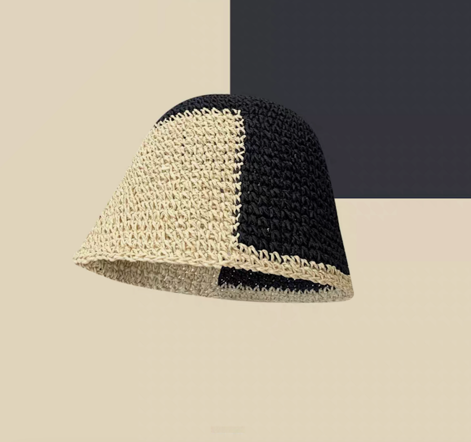 Black and white color-block straw bucket hat front view breathable woven summer design with contrast panels