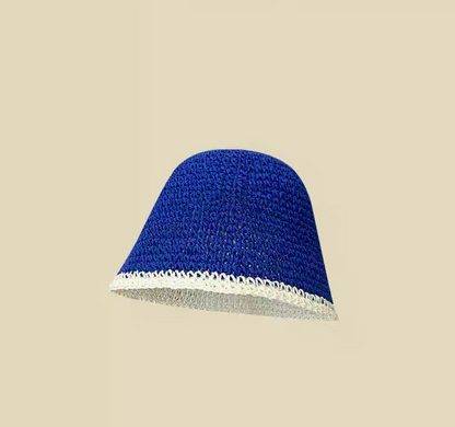 White and blue straw bucket hat with blue outer panel side view