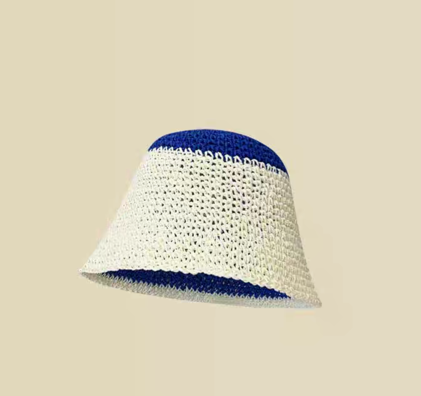 White and blue straw bucket hat reverse side showing white outer panel and blue top