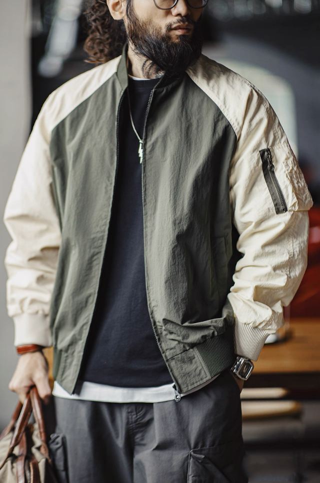 Model styling MA-1 bomber with cargo pants for street look