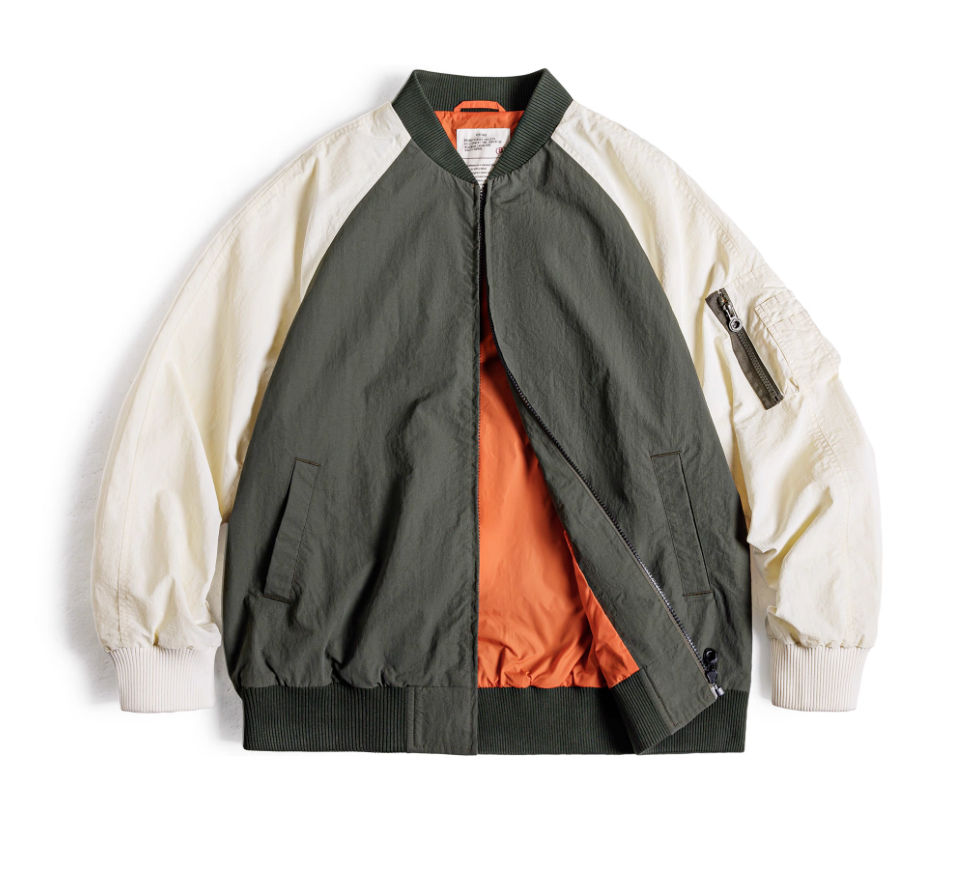 Front view of color-block MA-1 bomber in army green and cream with orange lining