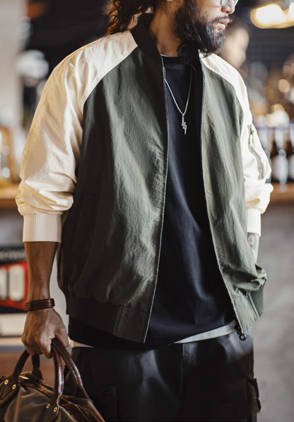 Side angle of army green and cream bomber jacket