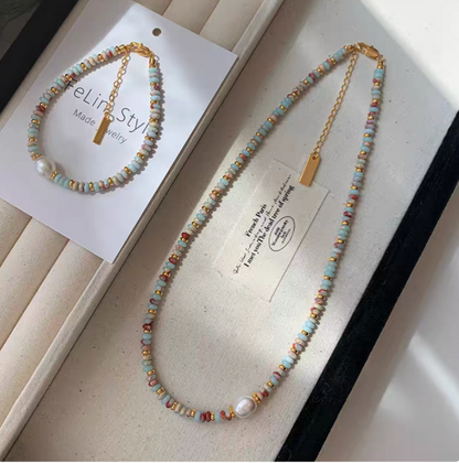 Colorburst jade and pearl jewelry set featuring multicolor beaded necklace and matching bracelet with freshwater pearl and gold-plated details on display tray