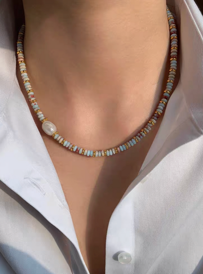 Close-up of Colorburst jade and pearl necklace worn on neck with multicolor beads, freshwater pearl accent, and gold-plated elements