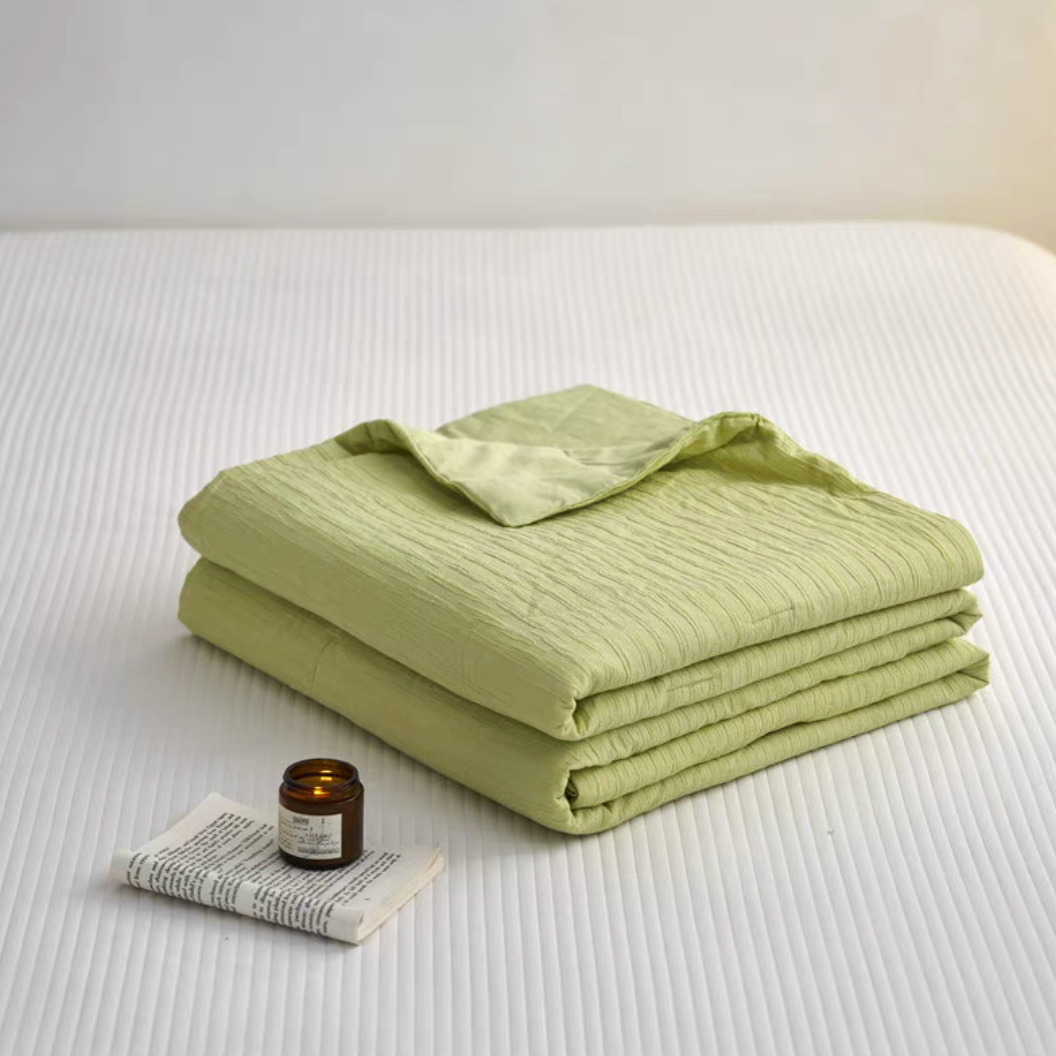 Folded Green Colorful cotton comforter and sham set showing washed cotton fabric and jacquard wave texture