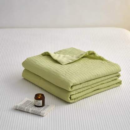Folded Green Colorful cotton comforter and sham set showing washed cotton fabric and jacquard wave texture
