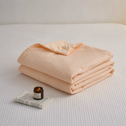 Folded Orange Colorful cotton comforter and sham set showing lightweight cotton fabric and jacquard wave texture