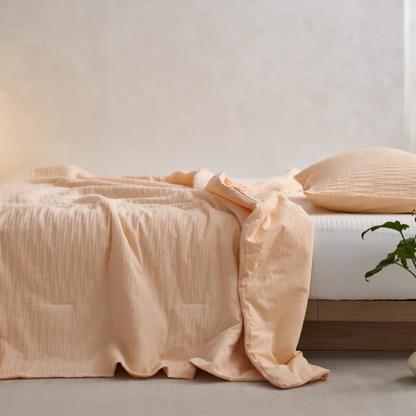 Orange Colorful cotton comforter and sham set side view draped over bed with soft washed cotton finish