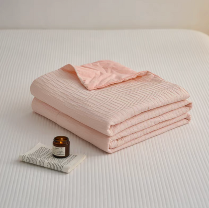 Folded Pink Colorful cotton comforter and sham set showing soft washed cotton fabric and jacquard wave texture