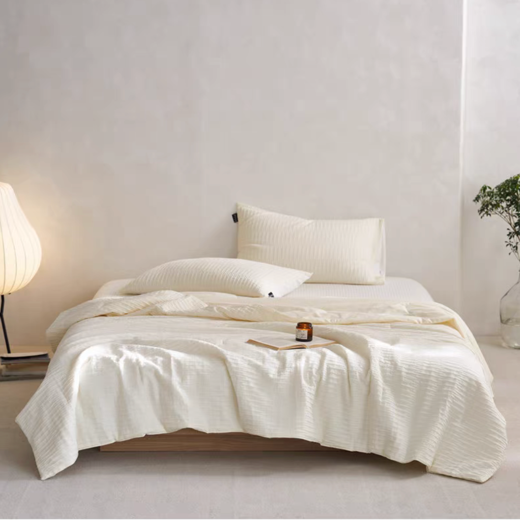 White Colorful cotton comforter and sham set displayed on bed with matching pillow shams and minimal bedroom styling