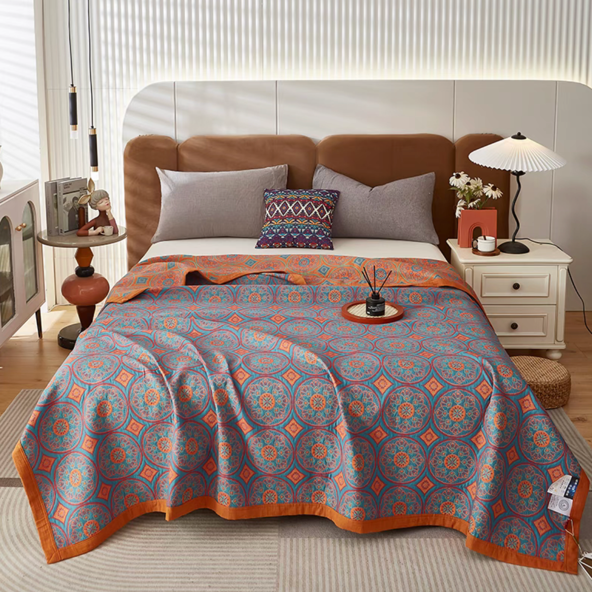 Colorful Harmony Cotton Woven Quilt Bolivia Blue displayed on bed with circular geometric woven pattern